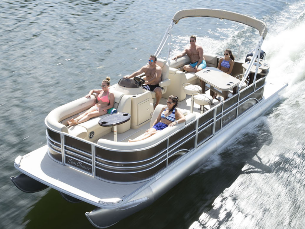 a group of people in a small boat in a body of water